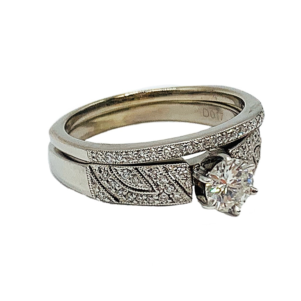 0.89 ctw 14k white gold bridal set w/ a 0.58CT round center diamond and matching band
