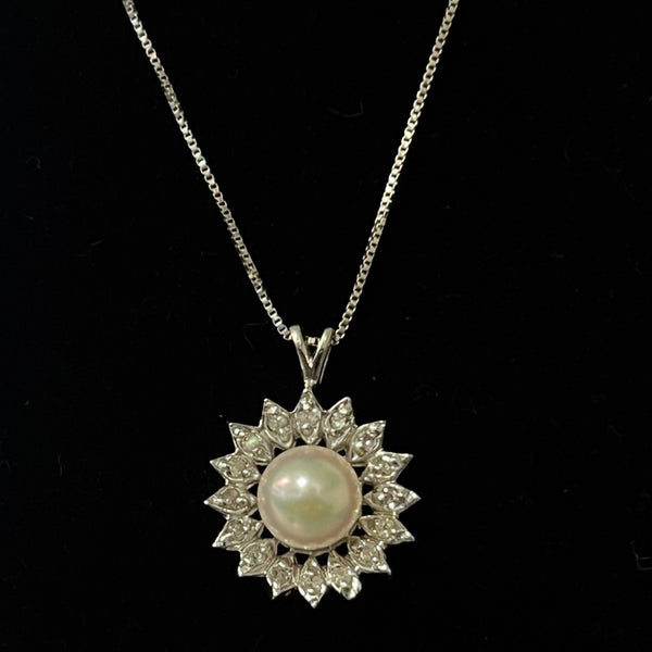 $299 14 Karat Pearl Flower Pendant