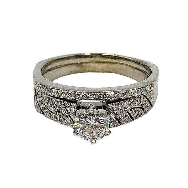 0.89 ctw 14k white gold bridal set w/ a 0.58CT round center diamond and matching band